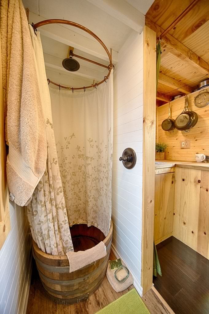 shower space made from recycled wooden barrel